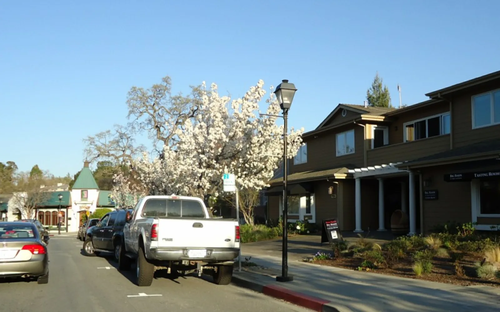 A California downtown main street with shops and community gathering spaces
